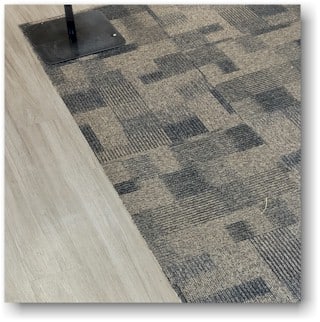 Carpet Tiles in Lobby next to vinyl plank flooring - Homefloorguide.com